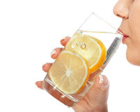 Woman drinking lemon water